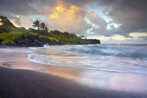 Waves-crashing-black-sand-beach-Hawaii